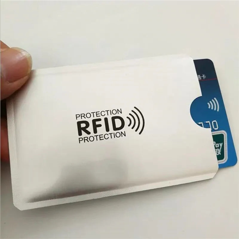 A white card holder with an RFID protection logo is shown being held by a hand.