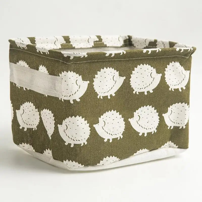 A woven storage basket made of olive green and white fabric with a textured pattern.