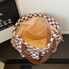 A brown and beige stripe pattern corduroy tote bag is shown from the top, featuring a padded interior.