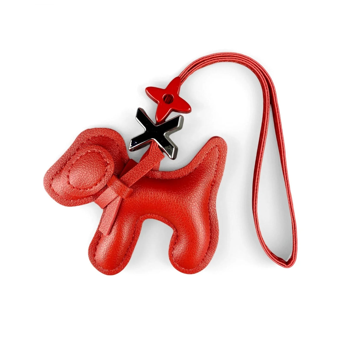 A red PU leather puppy bag charm with a bow tie attached to a thin red leather cord.
