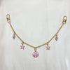 Gold chain necklace with pink gemstone charms and a starfish pendant