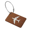 A brown aluminum luggage tag with a silver cord attached.