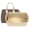 Light beige felt purse organizer insert with a tan leather handle and flap.