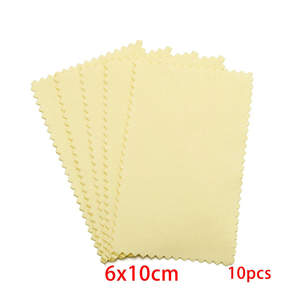 A set of ten yellow polishing cloths with serrated edges for silver and gold jewelry