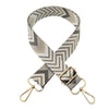 A beige and gray patterned nylon strap for bags and luggage
