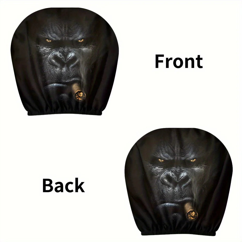 Front and back views of a black silicone car headrest cover featuring a fierce gorilla face with a gold nose ring.