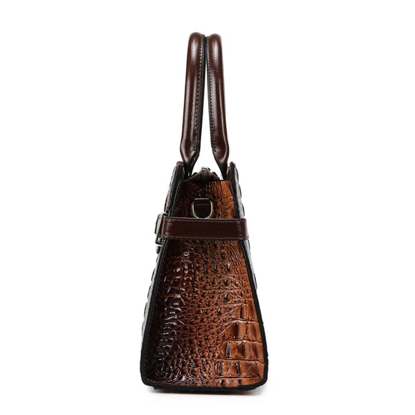 A brown crocodile embossed PU leather shoulder handbag set with leather straps.
