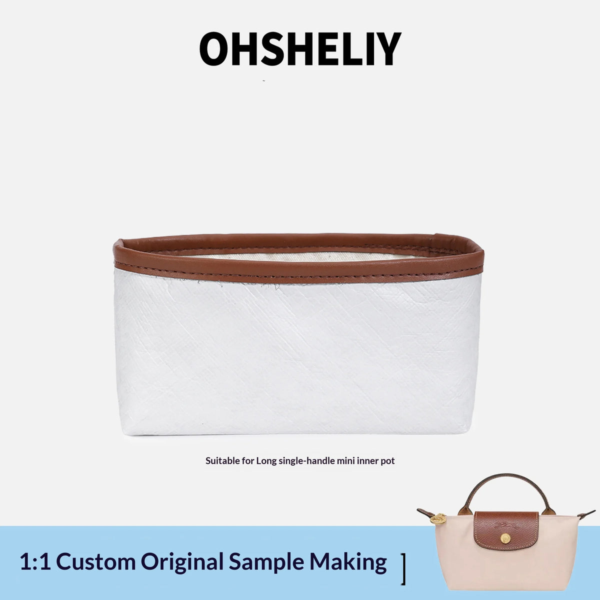 A white leather organizer insert for a mini pot or laptop sleeve with a brown trim.