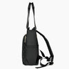 A black quilted women's backpack tote with black straps.