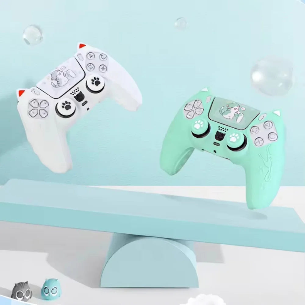 A white and green cat-themed silicone grip cover for a PlayStation controller is displayed on a light blue surface.