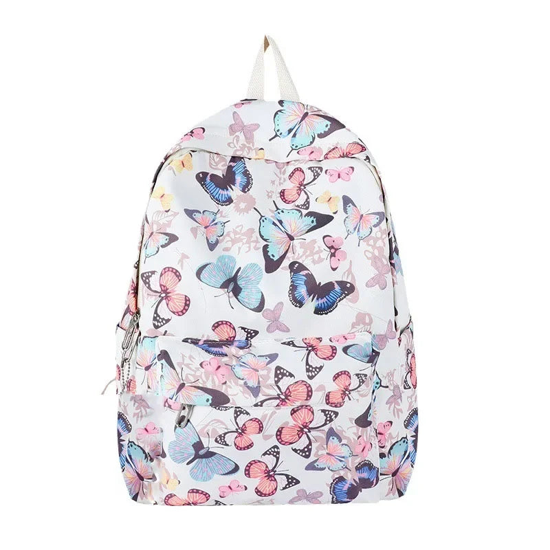 A light-colored backpack featuring a colorful butterfly pattern.