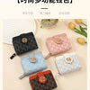 A collection of six chic wallets in various colors and patterns, including black, pink, blue, and brown, displayed on a light