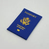 A dark blue leather passport holder with gold printing featuring the United States eagle and flag design.