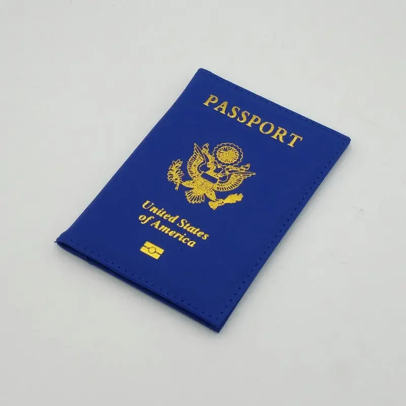 A dark blue leather passport holder with gold printing featuring the United States eagle and flag design.