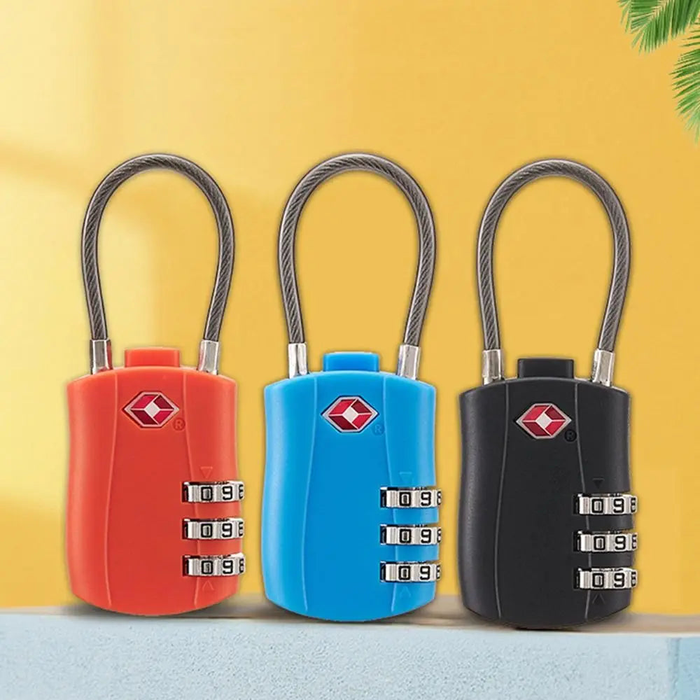 Three color combination cable locks with carabiner clasps displayed against a yellow background.