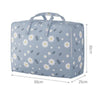 Light blue fabric storage bag with a floral pattern, designed for storing blankets and clothes.