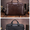 A brown genuine leather men's briefcase shown in a top-down view with a leather strap and a vintage box.