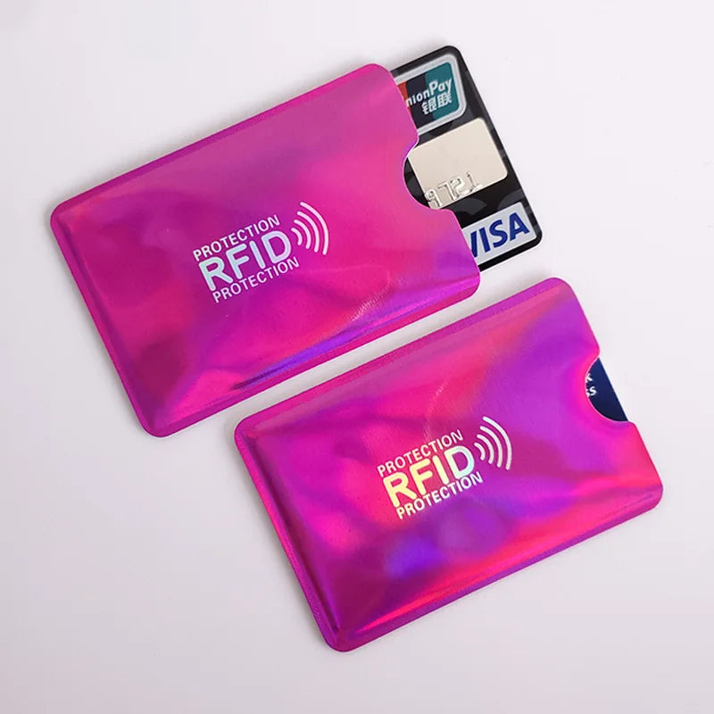 Two vibrant pink RFID protection card sleeves are shown, one containing a credit card.