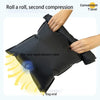 Hands are compressing a black reusable vacuum storage bag, demonstrating the one-way rapid exhaust valve.
