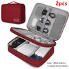 A red portable digital organizer storage pouch with an open lid showing various cables and electronic components inside.