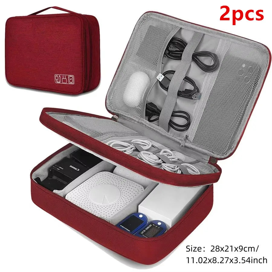 A red portable digital organizer storage pouch with an open lid showing various cables and electronic components inside.