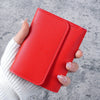 A hand holds a red slim multi-functional card wallet for students.