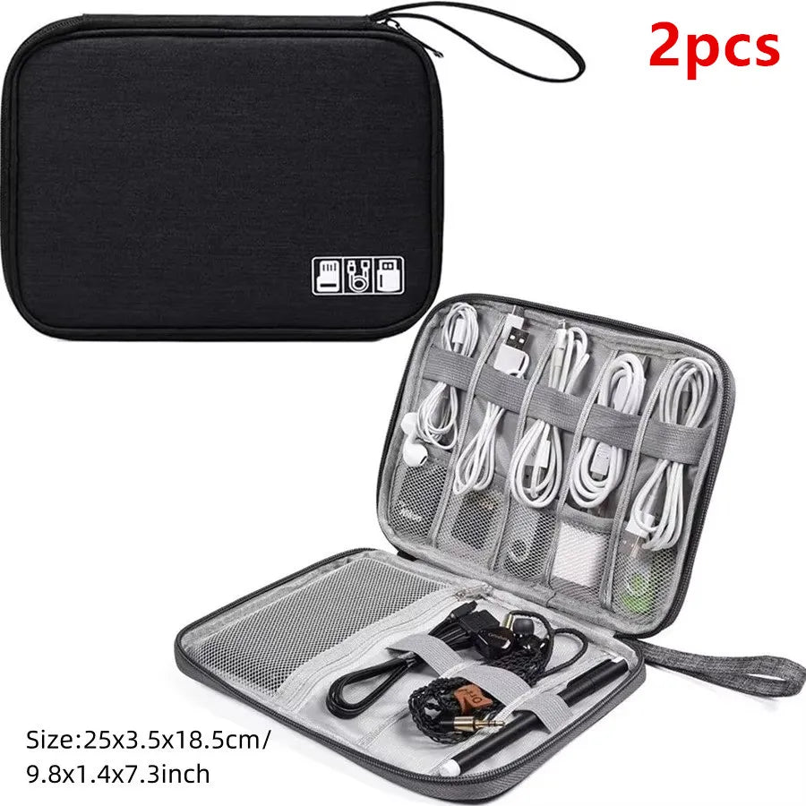 A black portable digital organizer storage pouch with an open compartment showing multiple wires and accessories.