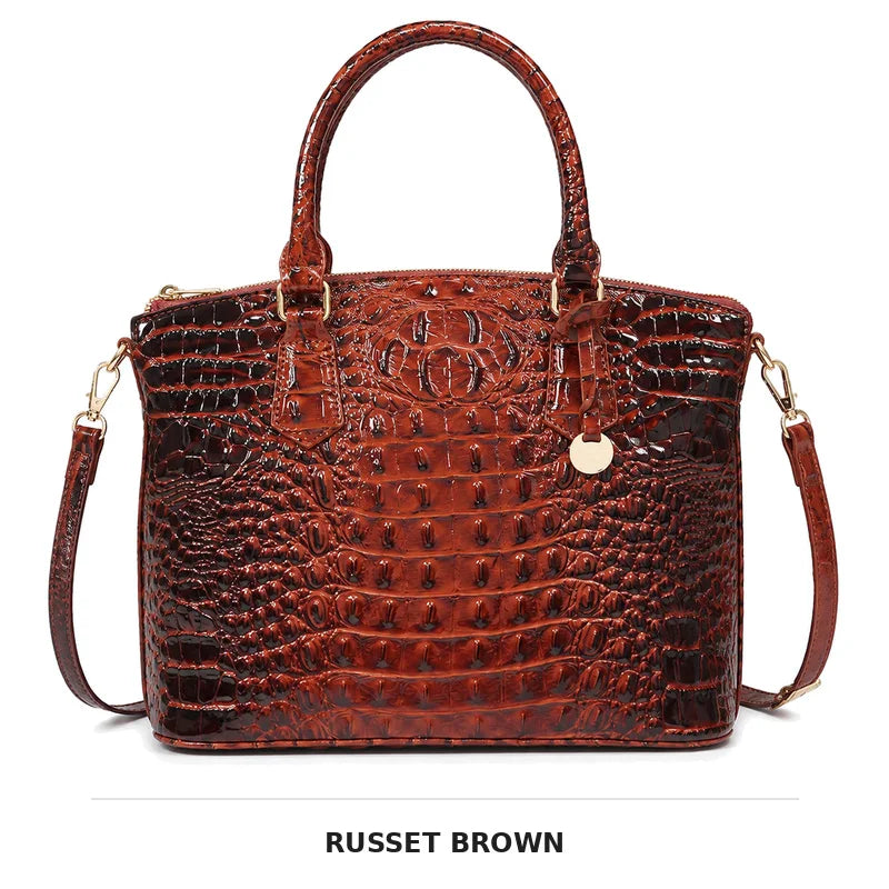 Rostbraunes Krokodilmuster-Top-Handtasche mit Gold-Hardware als Crossbody-Bag.