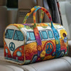 A colorful quilted travel duffle bag featuring a Volkswagen Beetle design with floral and psychedelic patterns.
