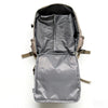 A gray compact travel backpack is shown open, displaying its interior storage and organization.
