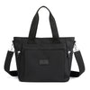Black durable nylon tote bag with black straps and zipper closure