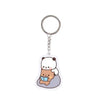A clear plastic keychain charm featuring a cute cartoon bear character.