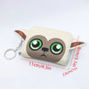 A beige loungefly zipper wallet shaped like a cartoon animal with large green eyes and brown ears.