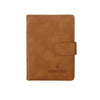 A brown leather passport organizer with a flap closure and the word PASSPORT embossed on it.