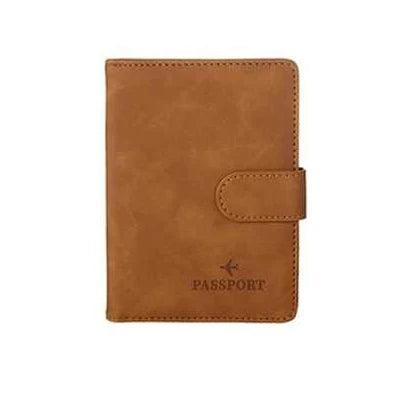 A brown leather passport organizer with a flap closure and the word PASSPORT embossed on it.