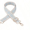 A light blue and white patterned replacement bag strap with silver hardware.