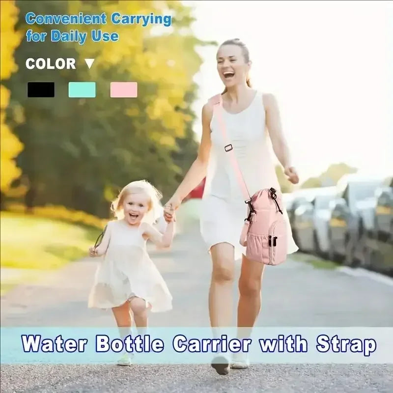 A woman is carrying an insulated water bottle carrier with a strap while walking outdoors.