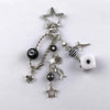 Silver Y2K 8 Ball keychain charm featuring a star and various charms for keys and bags