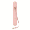 A pink vintage leather glove holder strap with a metal clasp and leather loop.