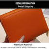 Orange leather card holder displayed in detail showing its texture and premium material quality