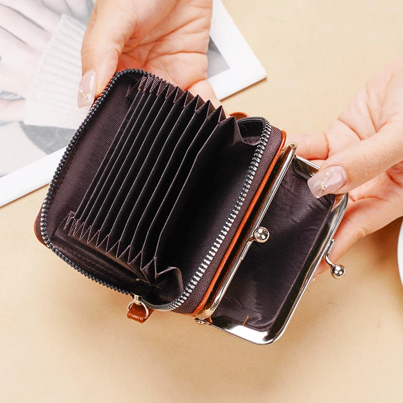 A hand opens a dark brown vintage PU leather compact wallet with a coin pocket.