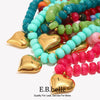 A vibrant necklace featuring multicolored heart-shaped beads in shades of blue, green, pink, and red.