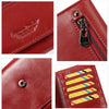 Close-up view of a red genuine leather wallet showing stitching, zipper detail, and RFID protection stripes.
