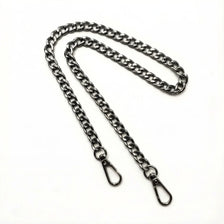 A silver metal chain crossbody strap laid out on a white background.
