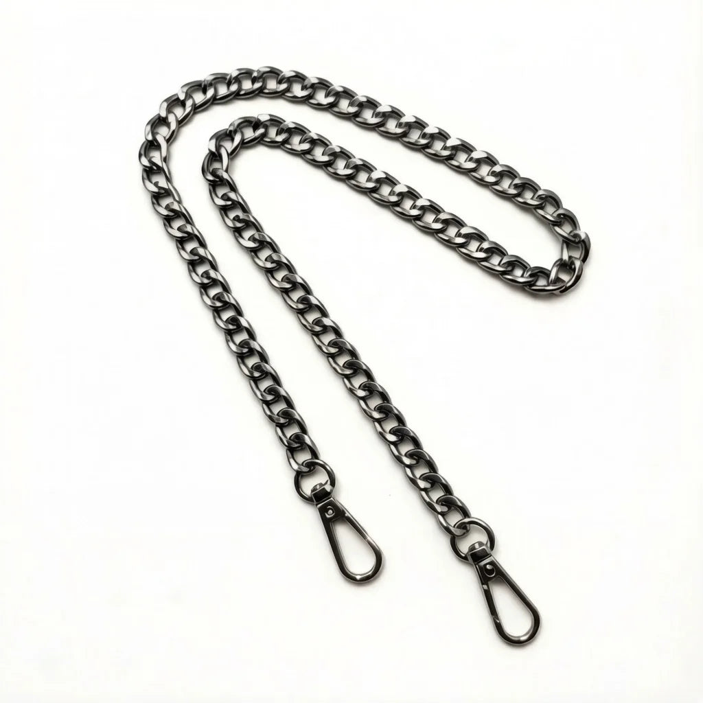 A silver metal chain crossbody strap laid out on a white background.
