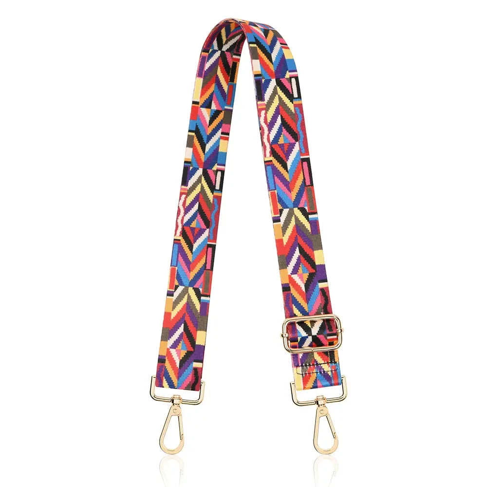 A colorful, patterned nylon crossbody bag strap with gold-toned hardware.