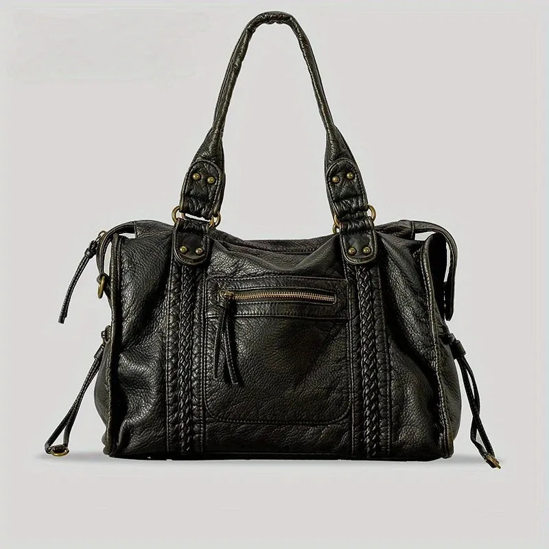A black vintage washed leather tote bag with gold hardware shown from the front.