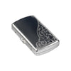 A silver metal cigarette case with an ornate scroll design, shown from a slight angle.
