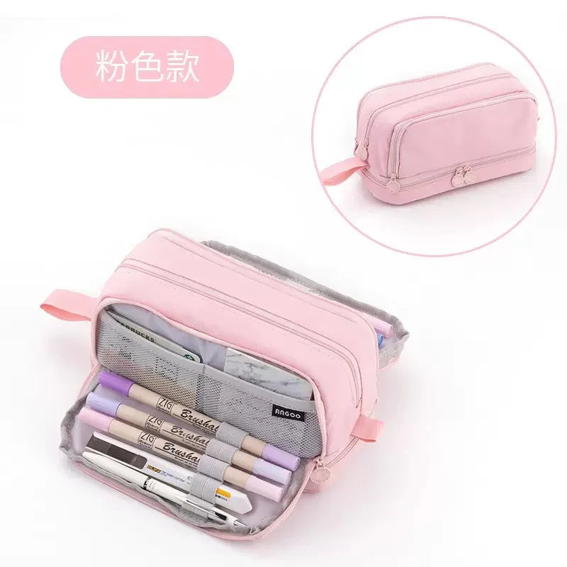 Pink multifunctional pencil case containing various writing tools and stationery.
