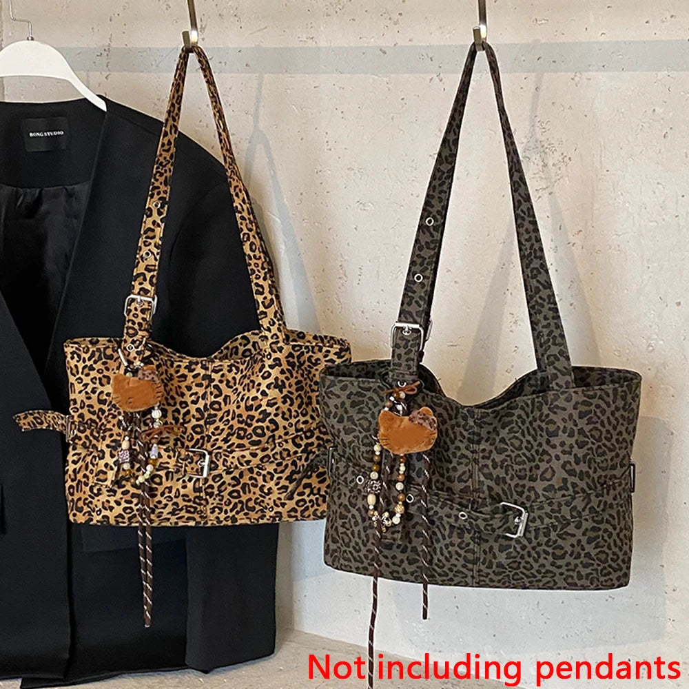 A black blazer is displayed next to a leopard print casual tote bag with brown leather accents.